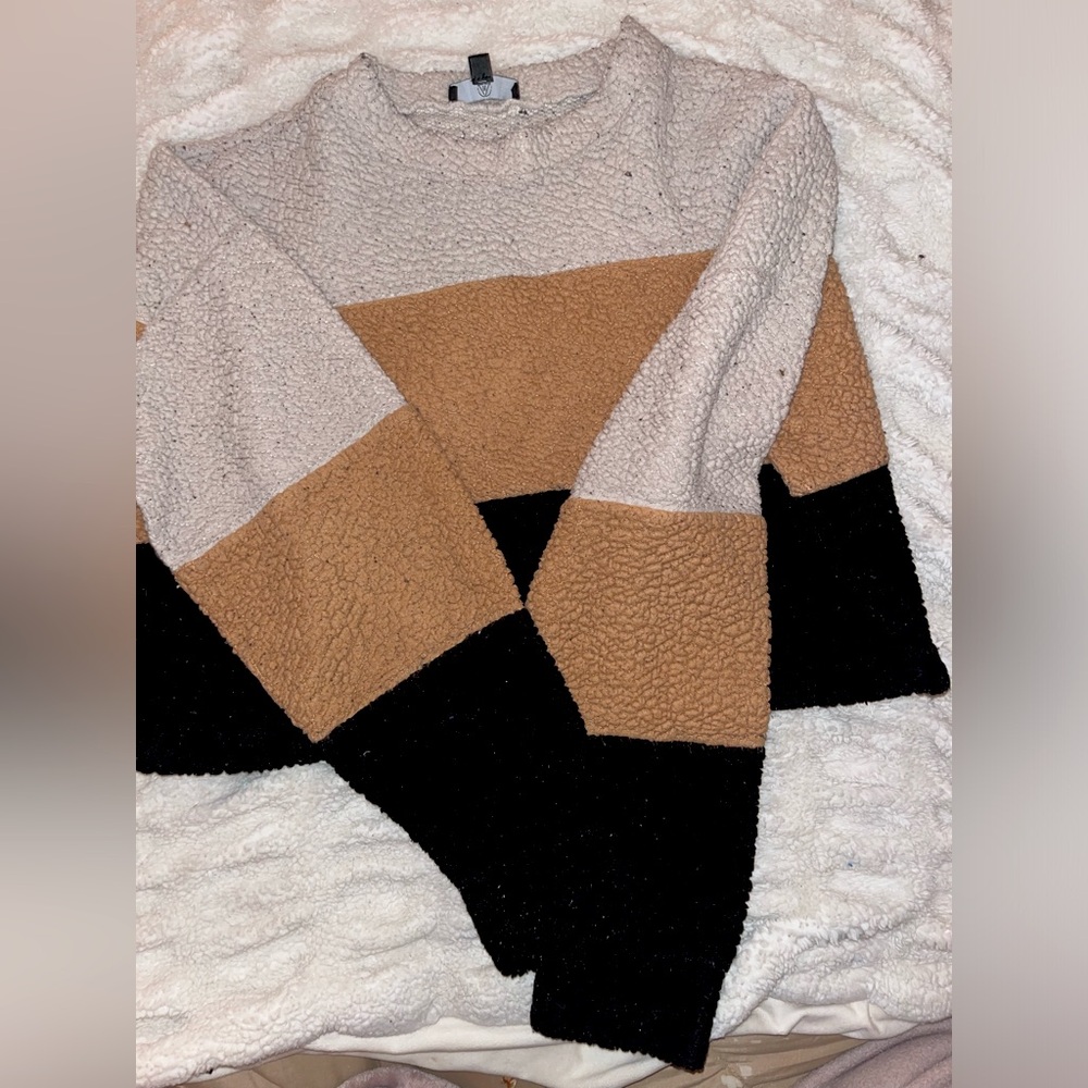 White pink and black sweater
